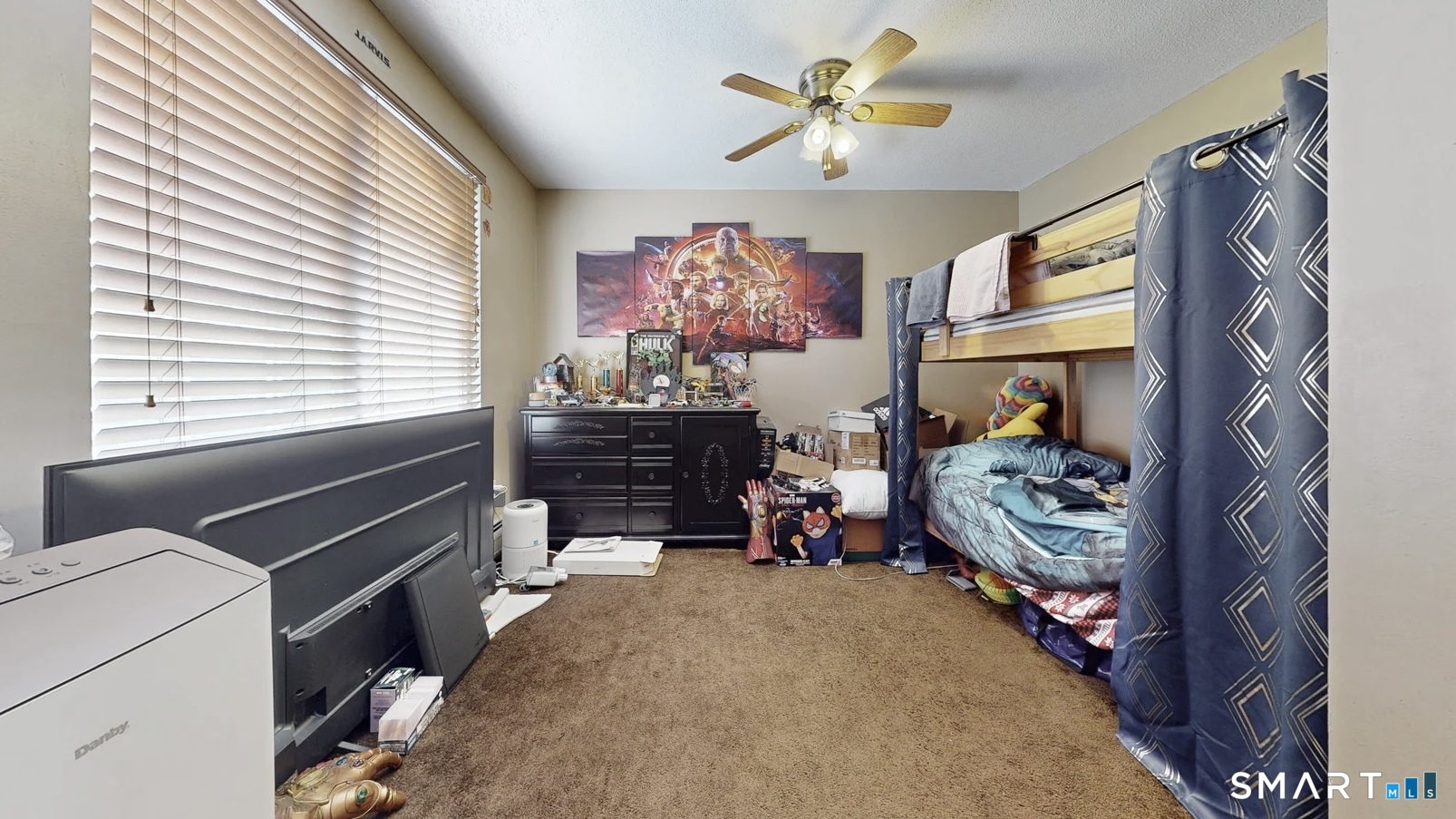 26-5 Guiel Place, Unit 8 Meriden, CT 06450 - Photo 14 of 14 a bedroom with a bed and a chandelier