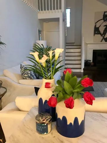 a view of a vase of flowers sitting on a table