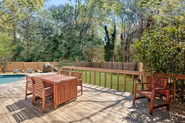 a view of a dinning table and chairs in the patio
