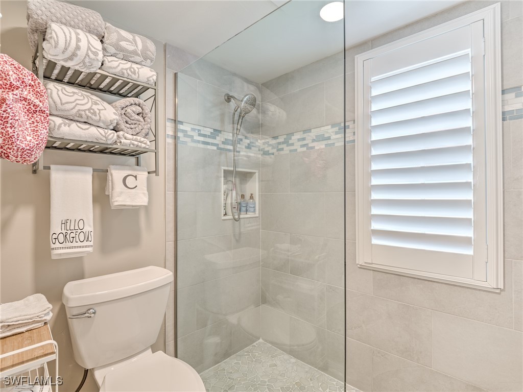 14981 Rivers Edge Court, Unit 228 Fort Myers, FL 33908 - Photo 20 of 40 a bathroom with a toilet and a shower
