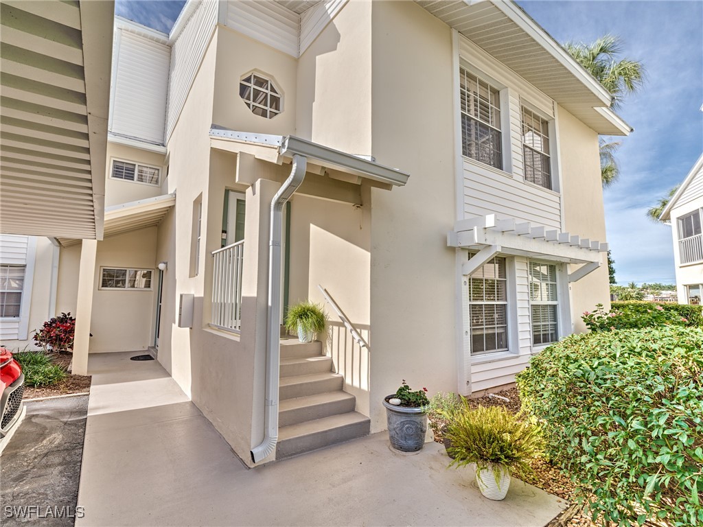 14981 Rivers Edge Court, Unit 228 Fort Myers, FL 33908 - Photo 2 of 40 a view of a building with a outdoor space