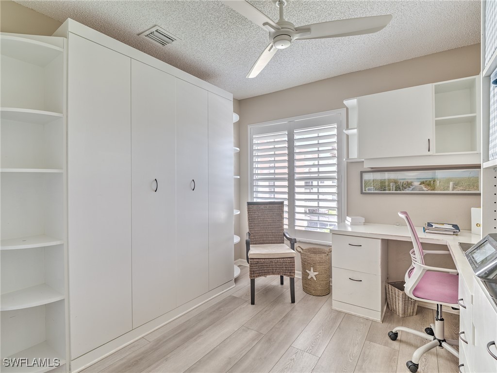 14981 Rivers Edge Court, Unit 228 Fort Myers, FL 33908 - Photo 22 of 40 a view of a workspace with furniture and a window
