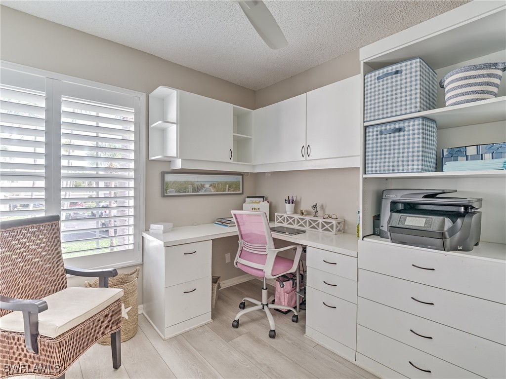 14981 Rivers Edge Court, Unit 228 Fort Myers, FL 33908 - Photo 23 of 40 a kitchen with a stove window and cabinets