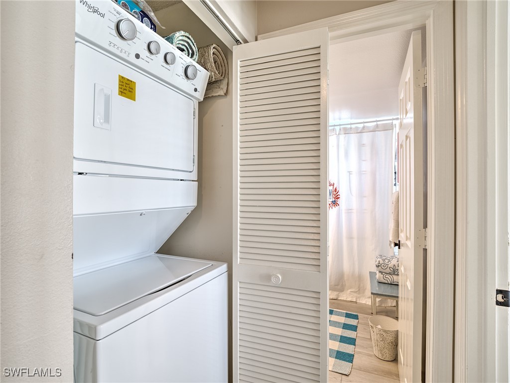 14981 Rivers Edge Court, Unit 228 Fort Myers, FL 33908 - Photo 28 of 40 a utility room with dryer and washer