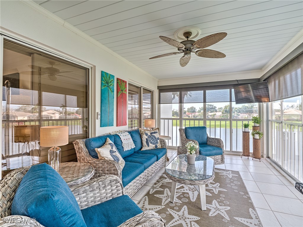 14981 Rivers Edge Court, Unit 228 Fort Myers, FL 33908 - Photo 30 of 40 a living room with furniture and a large window