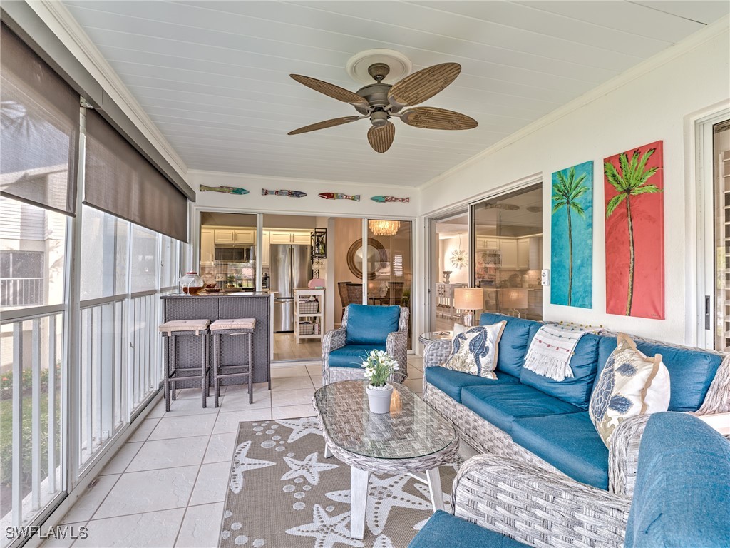 14981 Rivers Edge Court, Unit 228 Fort Myers, FL 33908 - Photo 31 of 40 a living room with furniture and a large window