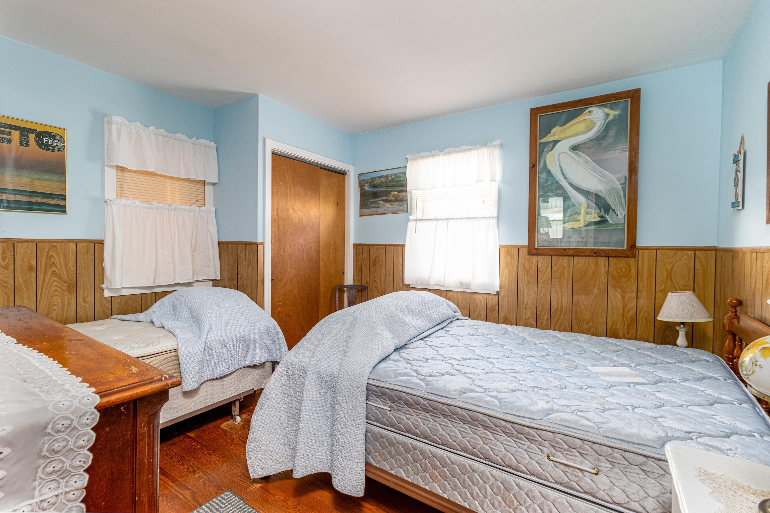 1745 1st Avalon, NJ 08202 - Photo 13 of 17 a bedroom with a bed and a painting on the wall