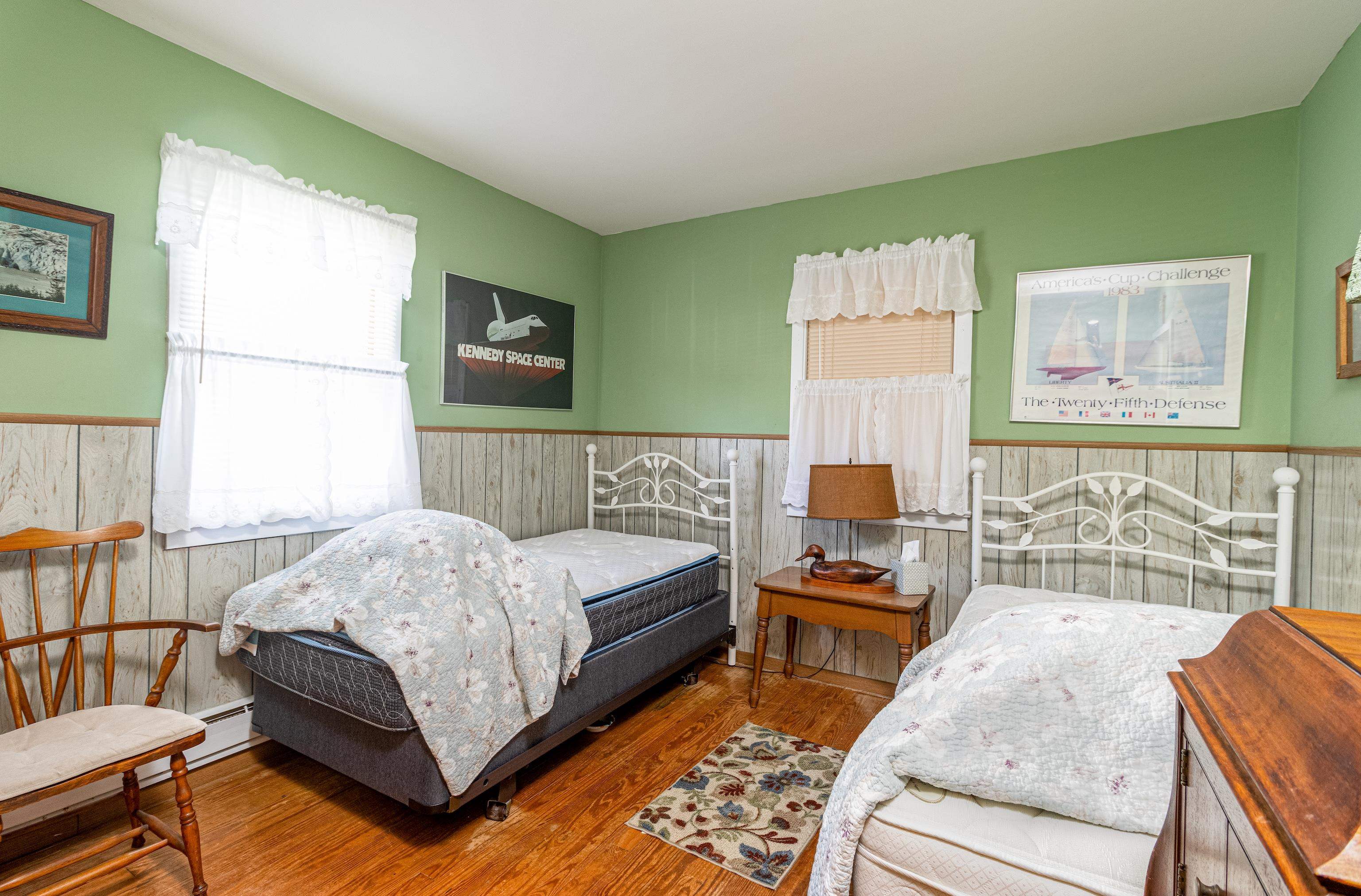1745 1st Avalon, NJ 08202 - Photo 14 of 17 a bedroom with a bed and wooden floor