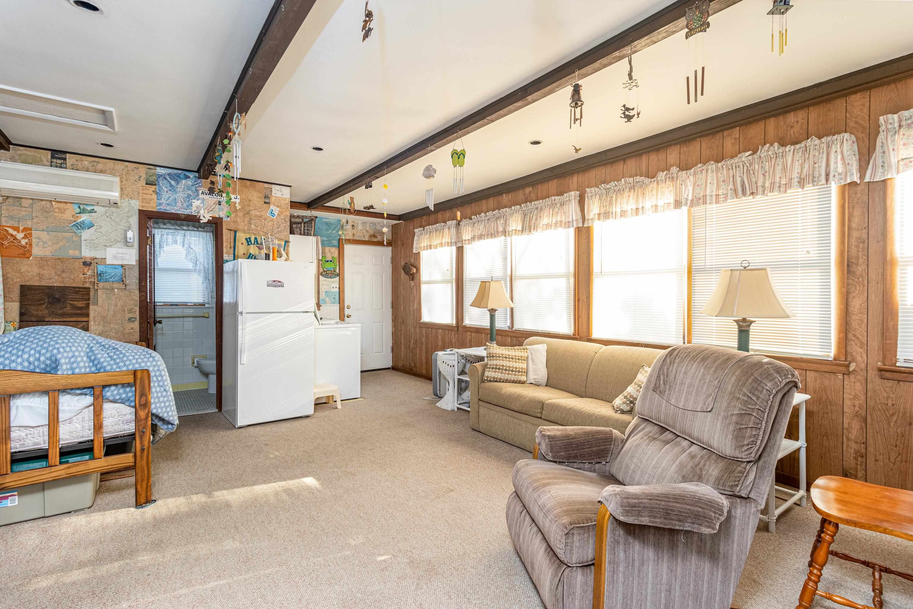 1745 1st Avalon, NJ 08202 - Photo 16 of 17 a living room with furniture and a large window
