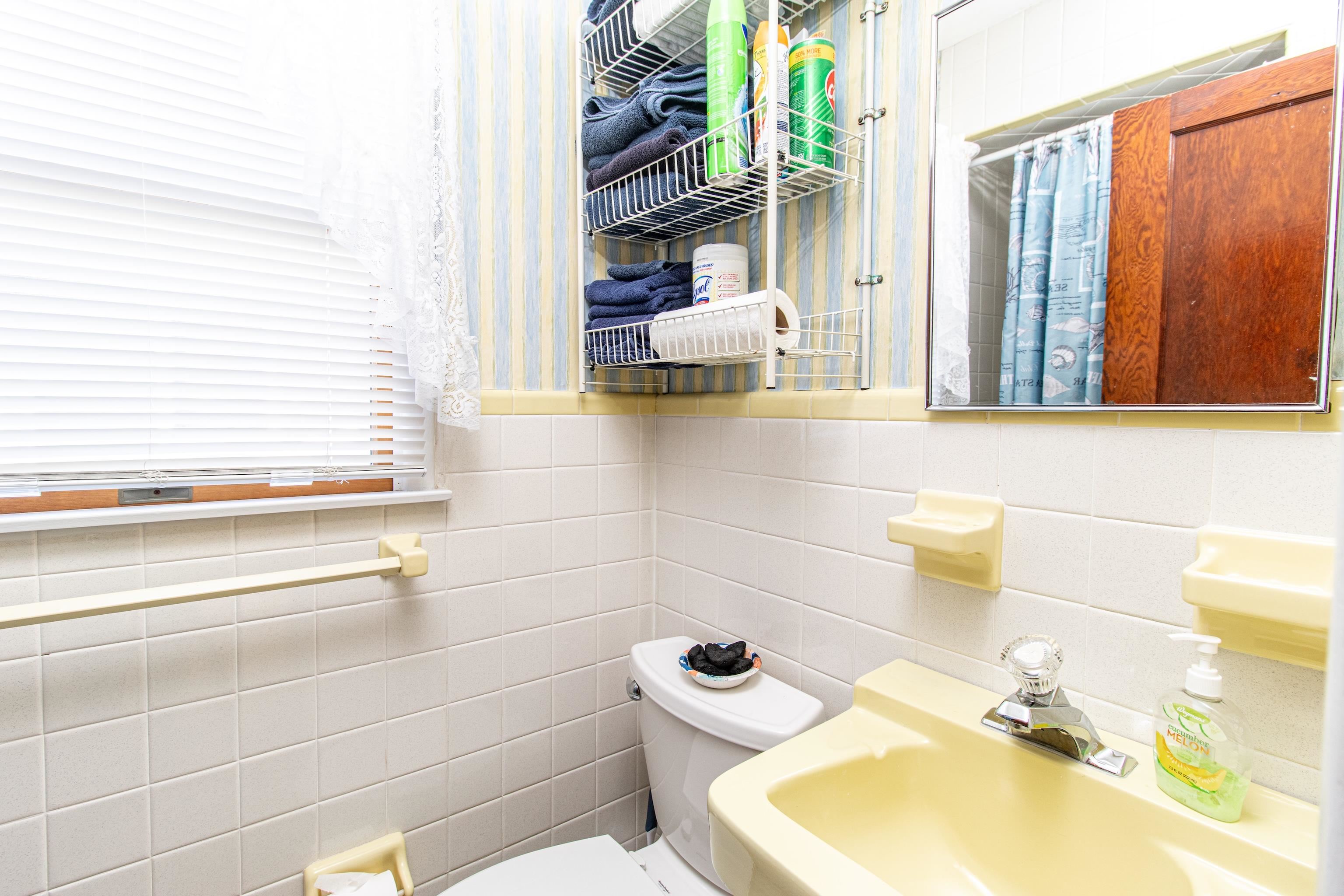 1745 1st Avalon, NJ 08202 - Photo 17 of 17 a bathroom with a sink and a mirror