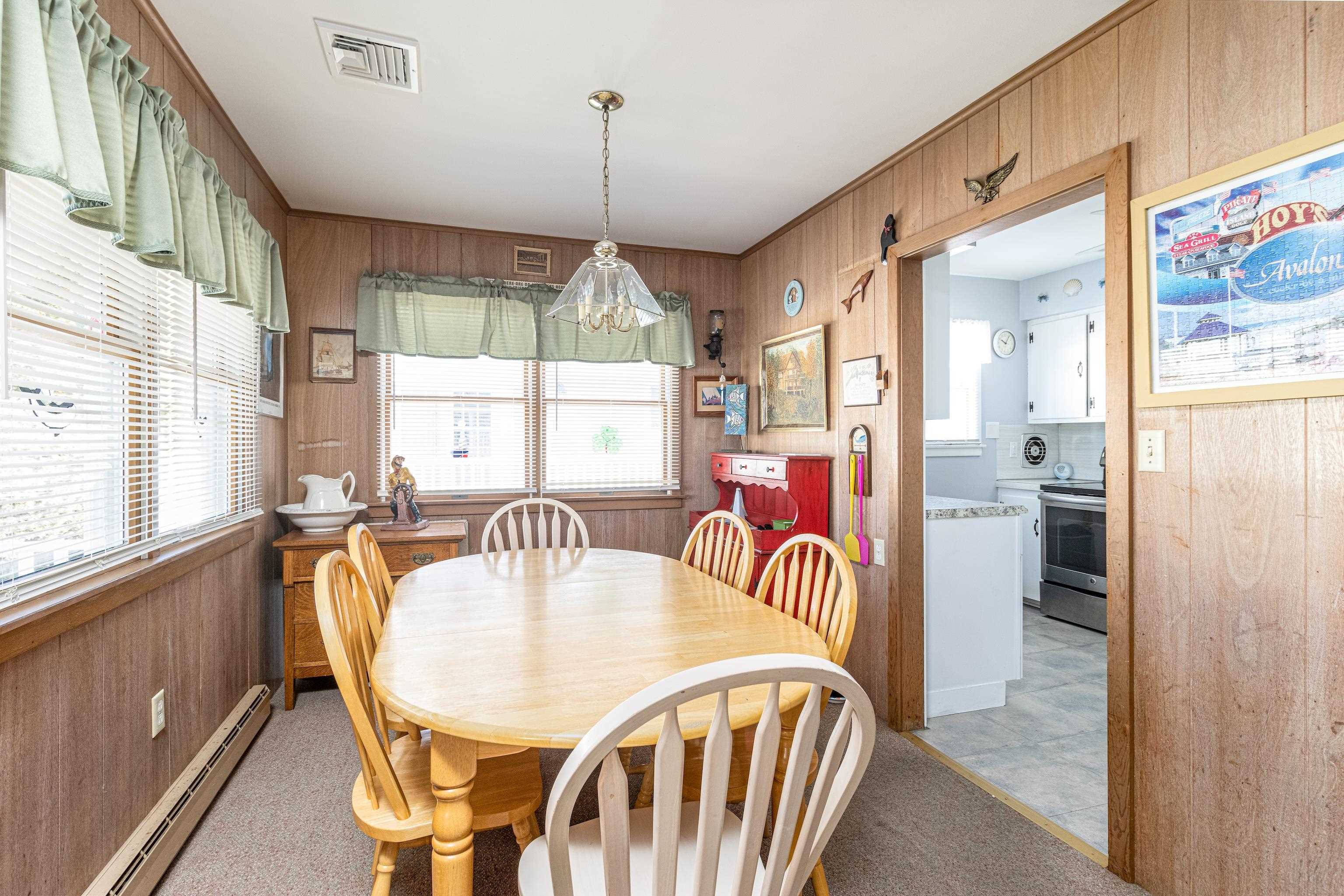 1745 1st Avalon, NJ 08202 - Photo 8 of 17 a view of a dining room with furniture window and wooden floor