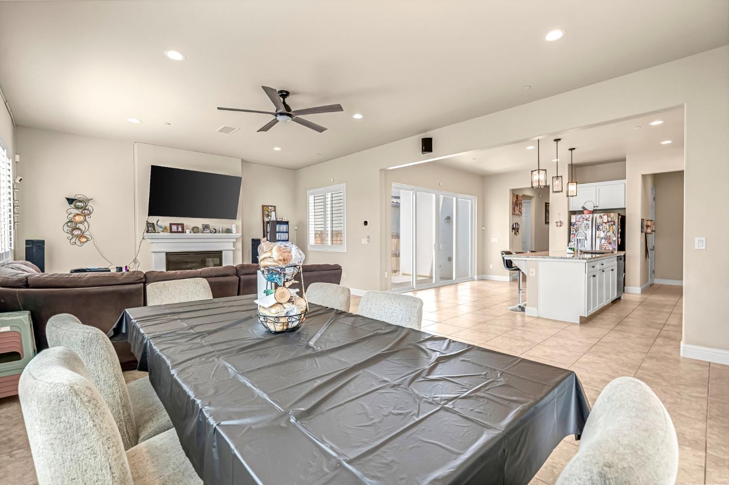 2468 Montana Avenue Clovis, CA 93619 - Photo 11 of 33 a living room with fireplace furniture and a flat screen tv