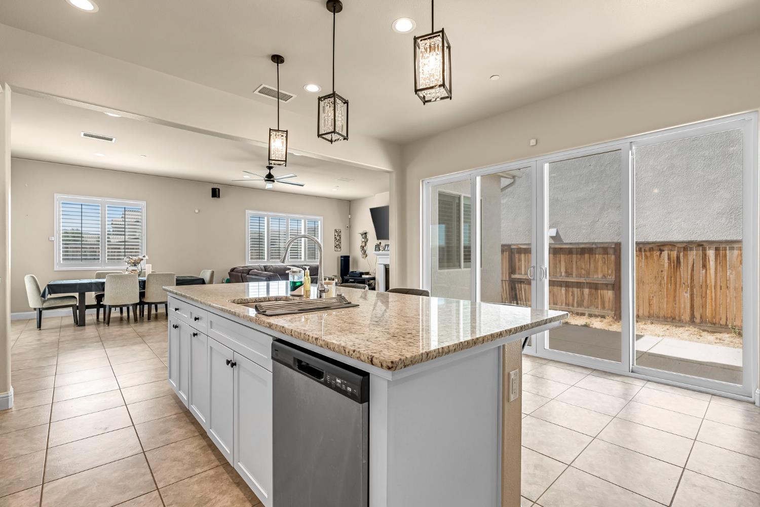 2468 Montana Avenue Clovis, CA 93619 - Photo 17 of 33 a open kitchen with stainless steel appliances granite countertop a sink and dishwasher with a large window