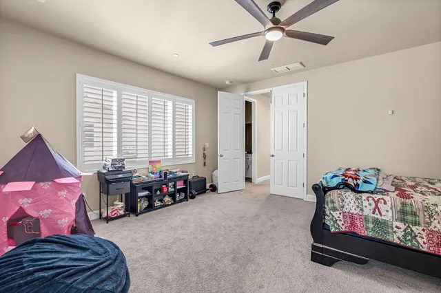 a living room with furniture toys and a window