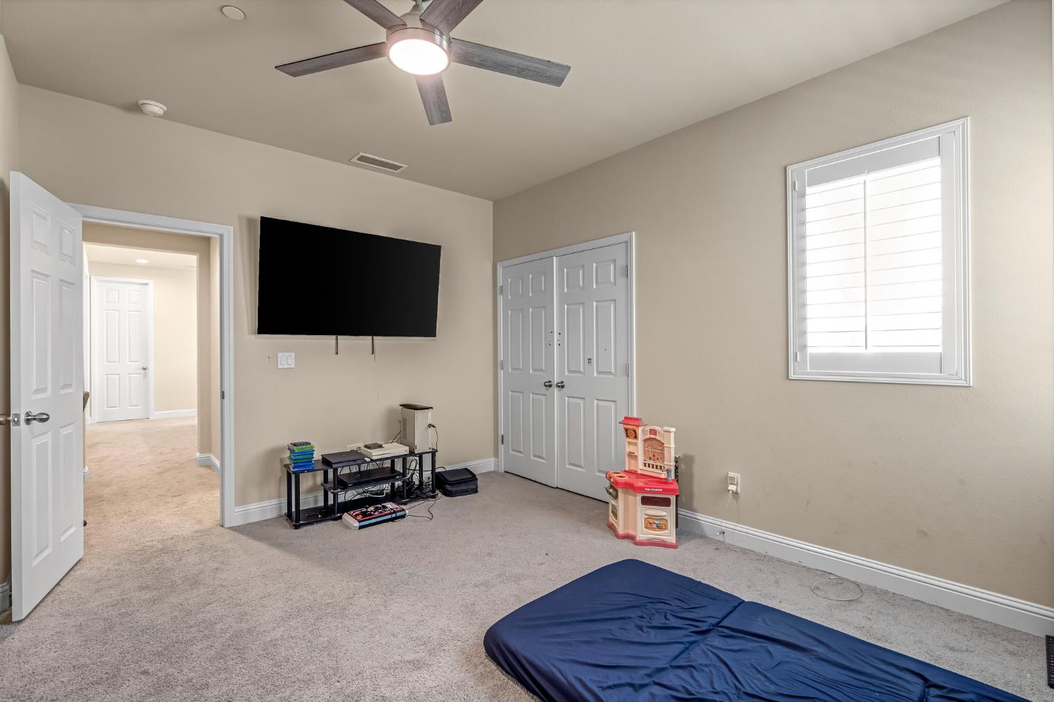 2468 Montana Avenue Clovis, CA 93619 - Photo 28 of 33 a living room with furniture and a flat screen tv