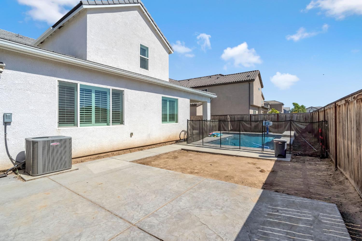 2468 Montana Avenue Clovis, CA 93619 - Photo 32 of 33 a view of a house with backyard and sitting area