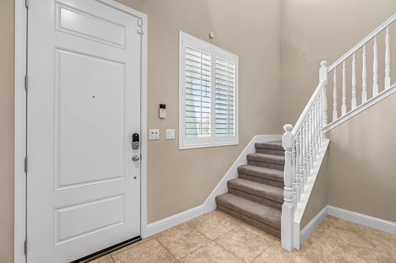 2468 Montana Avenue Clovis, CA 93619 - Photo 5 of 33 a view of entryway with stairs and wooden floor