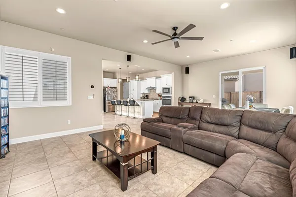 a living room with fireplace furniture and a flat screen tv