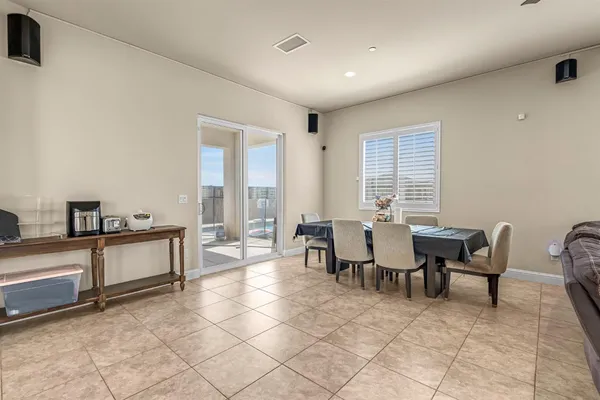 a large kitchen with stainless steel appliances granite countertop a lot of counter space and a sink