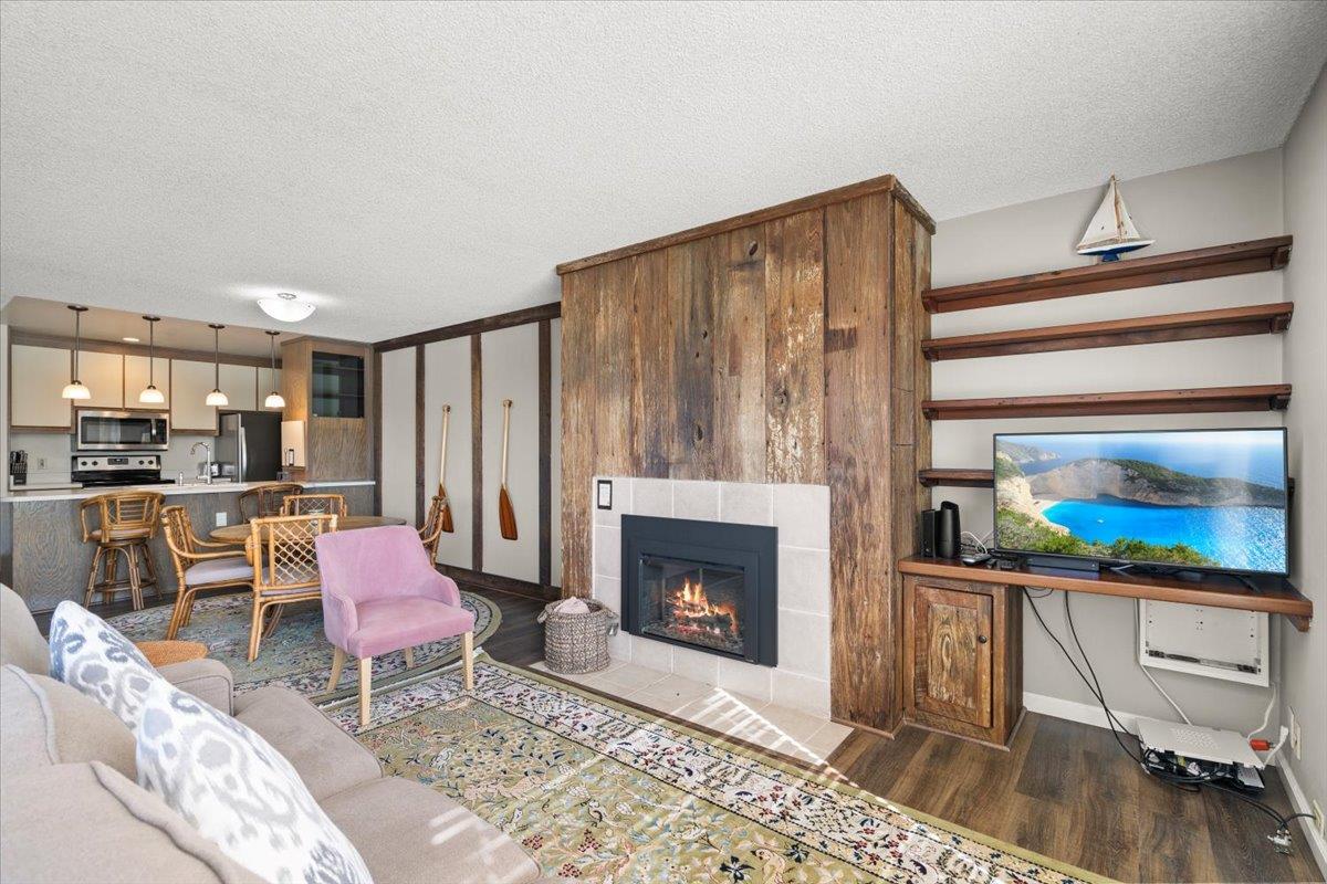 101 Shell Road, Unit 211 Watsonville, CA 95076 - Photo 14 of 29 a living room with furniture and a fireplace