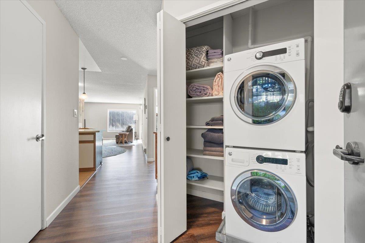 101 Shell Road, Unit 211 Watsonville, CA 95076 - Photo 17 of 29 a view of a hallway with washer and dryer