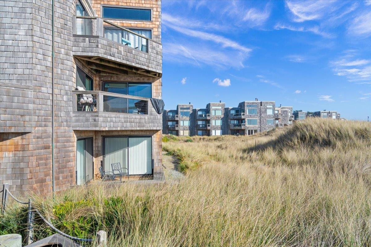 101 Shell Road, Unit 211 Watsonville, CA 95076 - Photo 18 of 29 a front view of a house with a yard