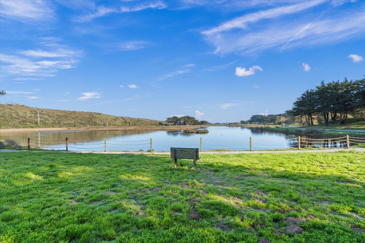 101 Shell Road, Unit 211 Watsonville, CA 95076 - Photo 23 of 29 a view of a lake with a building in the background
