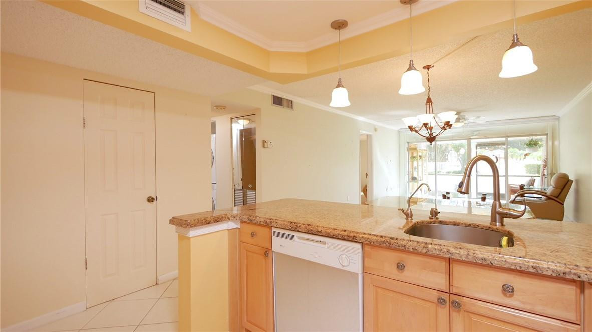 3930 Inverrary Boulevard, Unit 105D Lauderhill, FL 33319 - Photo 14 of 46 a bathroom with a sink and a mirror