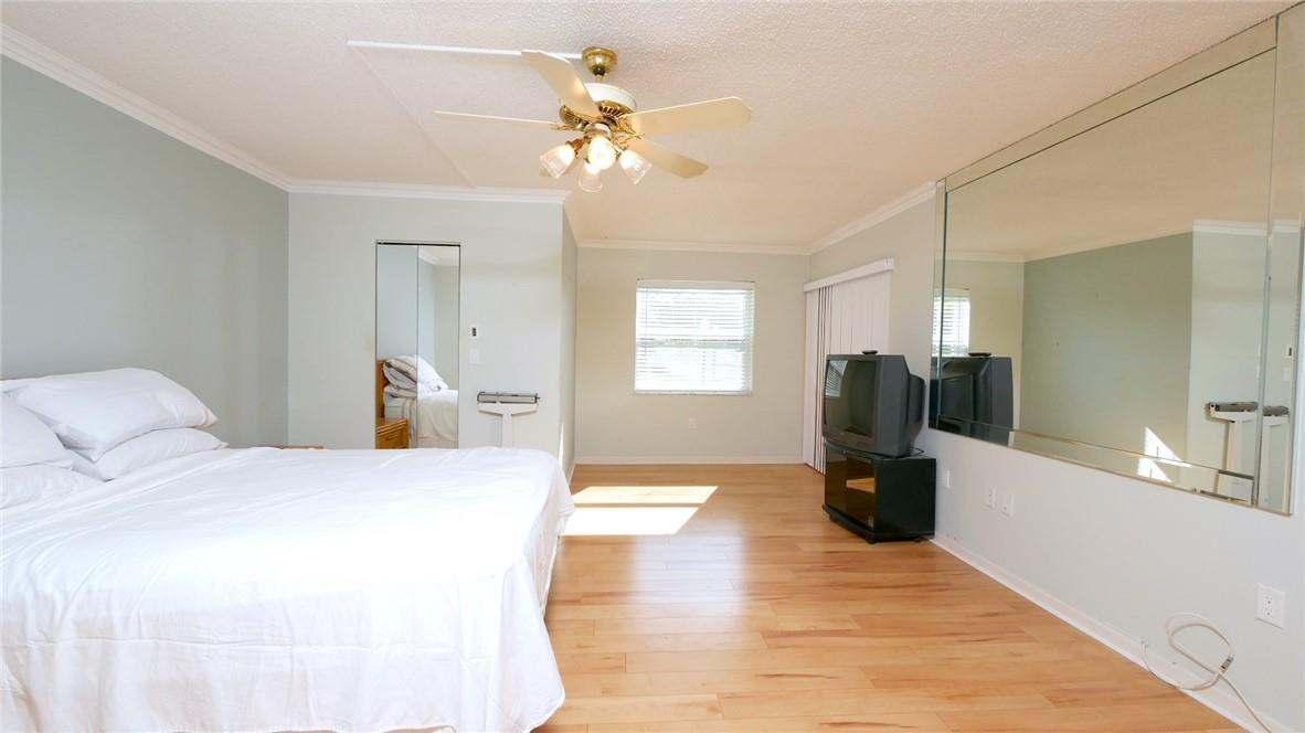 3930 Inverrary Boulevard, Unit 105D Lauderhill, FL 33319 - Photo 18 of 46 a bedroom with a bed and window
