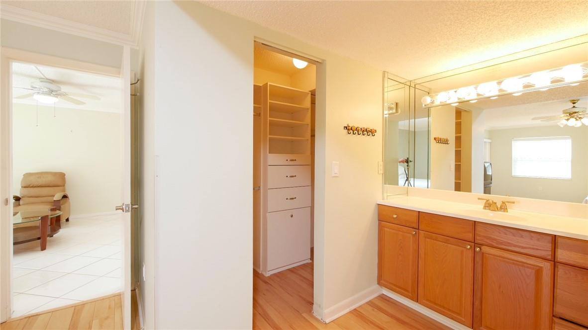 3930 Inverrary Boulevard, Unit 105D Lauderhill, FL 33319 - Photo 20 of 46 a en suite bathroom with a sink mirror and