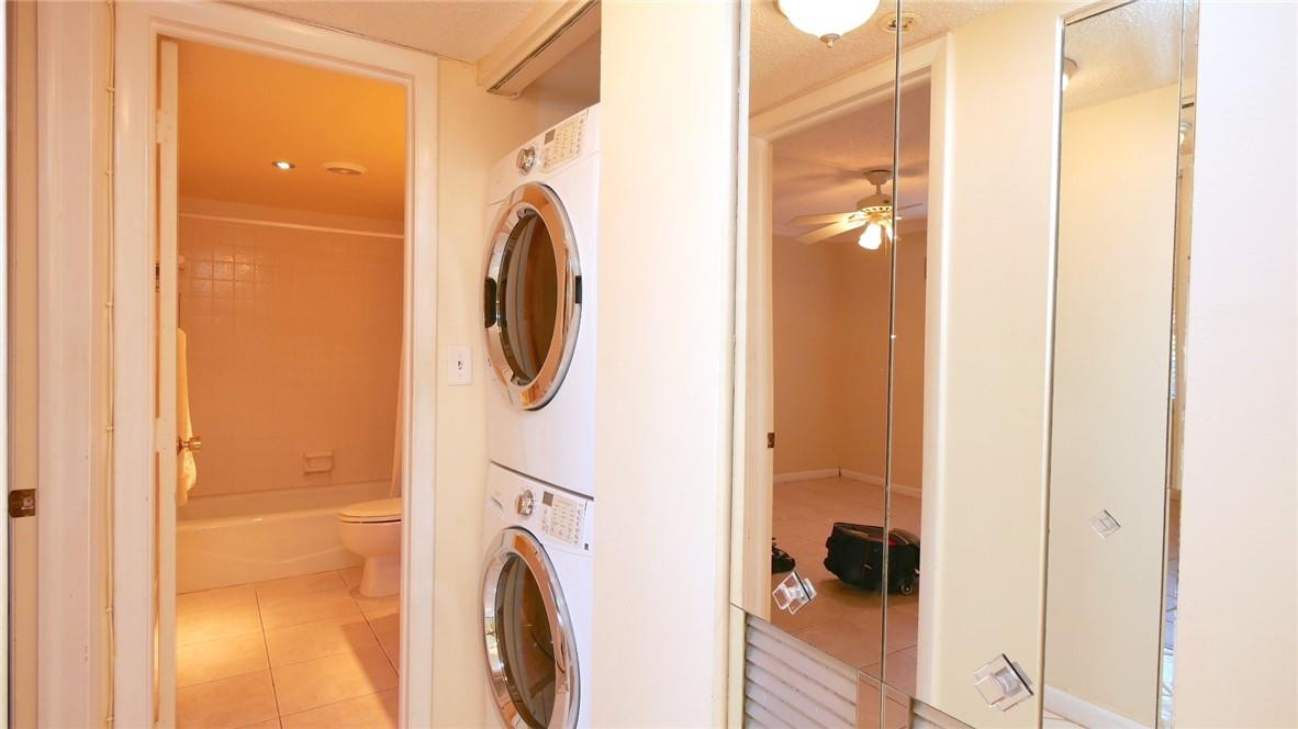 3930 Inverrary Boulevard, Unit 105D Lauderhill, FL 33319 - Photo 23 of 46 a utility room with dryer and washer
