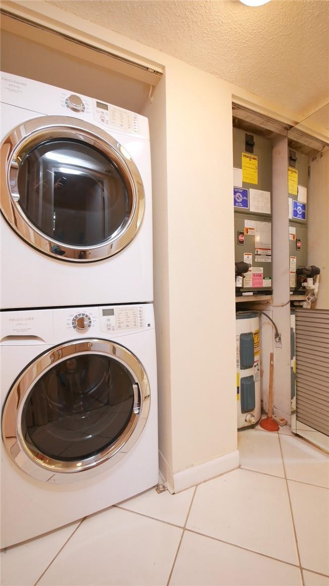 3930 Inverrary Boulevard, Unit 105D Lauderhill, FL 33319 - Photo 24 of 46 a utility room with dryer and washer