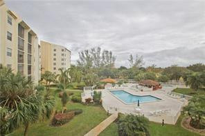 3930 Inverrary Boulevard, Unit 105D Lauderhill, FL 33319 - Photo 33 of 46 a view of a swimming pool with a patio