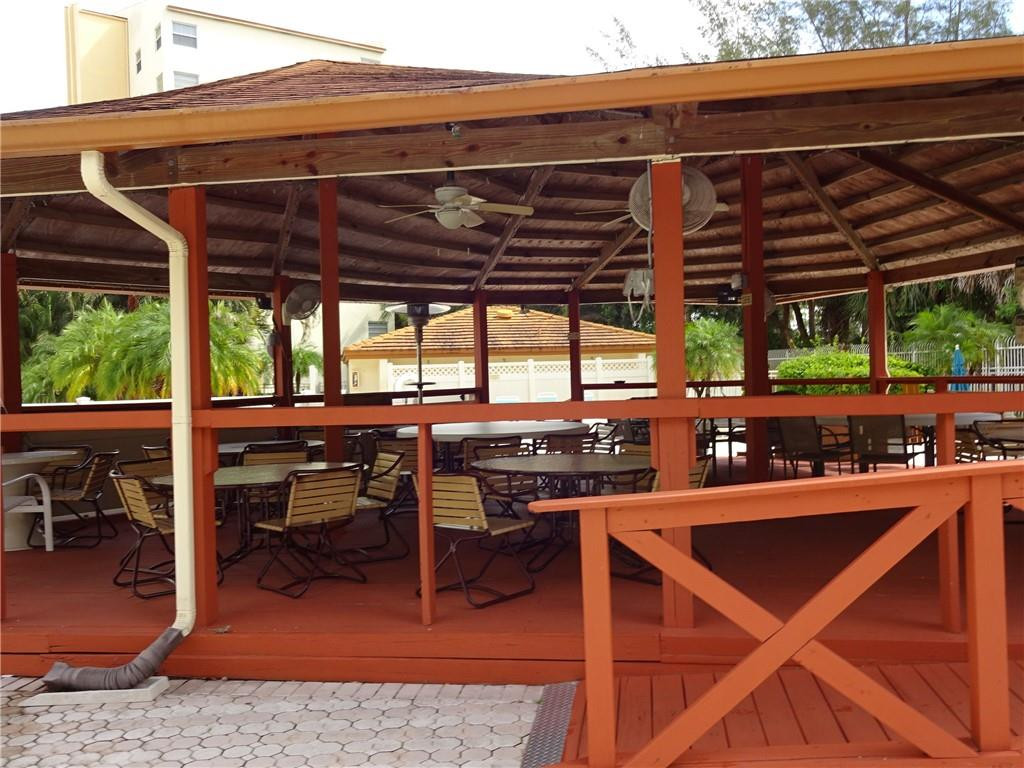 3930 Inverrary Boulevard, Unit 105D Lauderhill, FL 33319 - Photo 41 of 46 a view of a chairs and table in the patio and a backyard