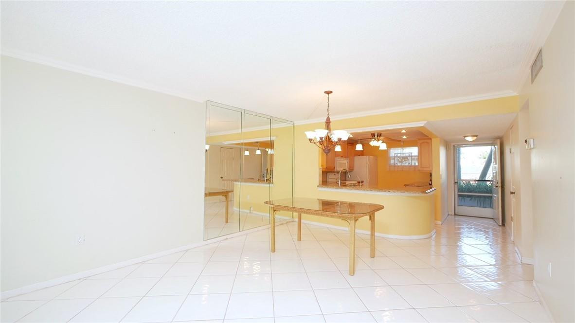 3930 Inverrary Boulevard, Unit 105D Lauderhill, FL 33319 - Photo 7 of 46 a view of kitchen with furniture and refrigerator