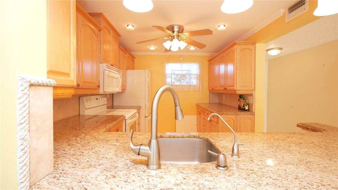3930 Inverrary Boulevard, Unit 105D Lauderhill, FL 33319 - Photo 9 of 46 a view of a bathroom with a tub and shower