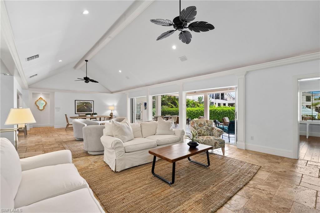 2201 Beacon Lane Naples, FL 34103 - Photo 11 of 25 a living room with furniture and a large window