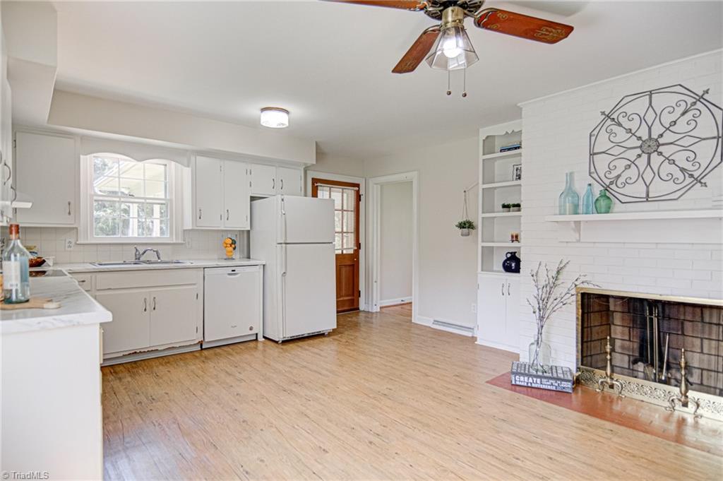 3602 Milhaven Road Winston-Salem, NC 27106 - Photo 3 of 36 Bright kitchen with laminate wood floors.