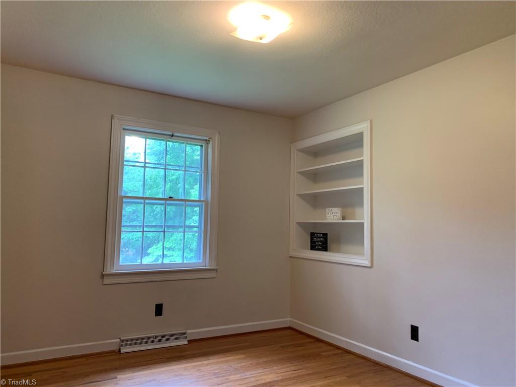 3602 Milhaven Road Winston-Salem, NC 27106 - Photo 23 of 36 Third bedroom with charming built-in shelves.