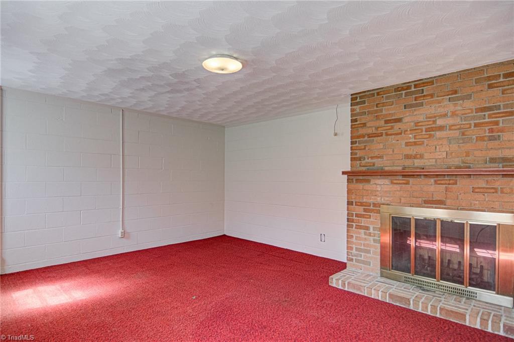 3602 Milhaven Road Winston-Salem, NC 27106 - Photo 25 of 36 Finished space in the basement with another fireplace.