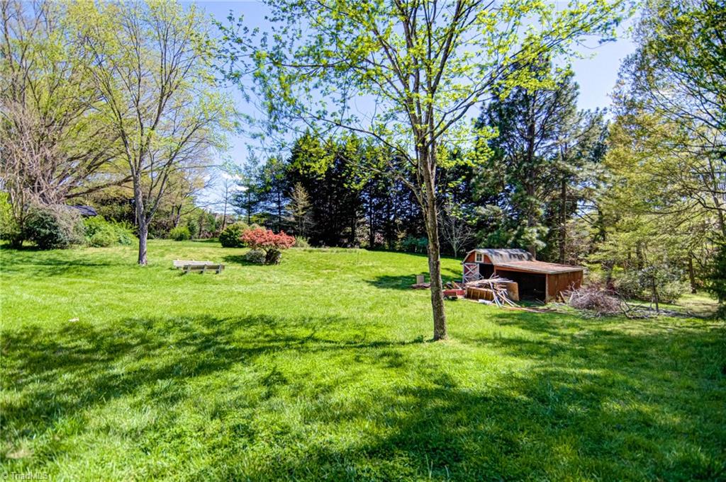 3602 Milhaven Road Winston-Salem, NC 27106 - Photo 30 of 36 This great backyard has an outdoor storage building.