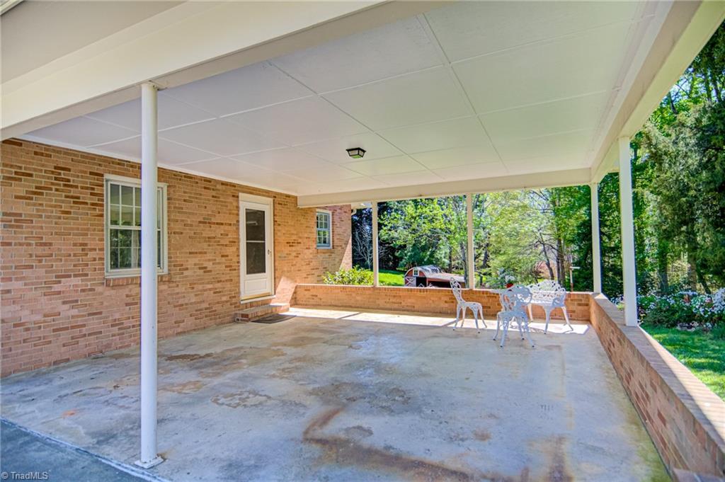 3602 Milhaven Road Winston-Salem, NC 27106 - Photo 33 of 36 Attached carport or this would be a great space to use for entertainment.