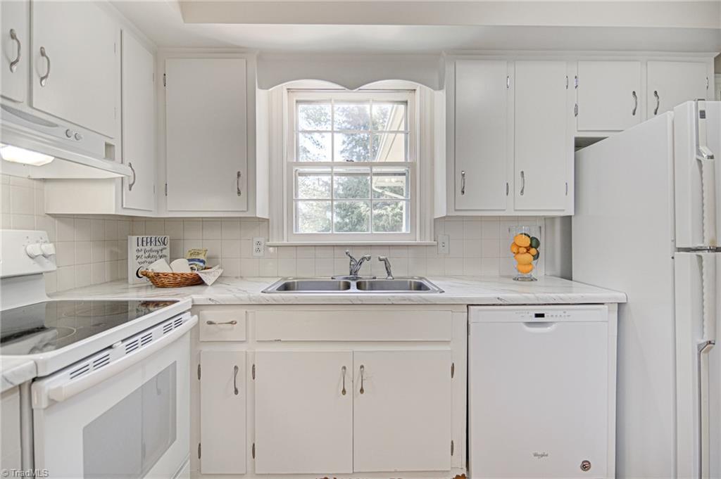 3602 Milhaven Road Winston-Salem, NC 27106 - Photo 5 of 36 White cabinets and updated backsplash.