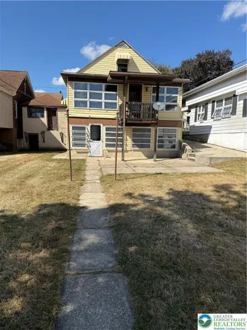 a front view of a house with swimming pool