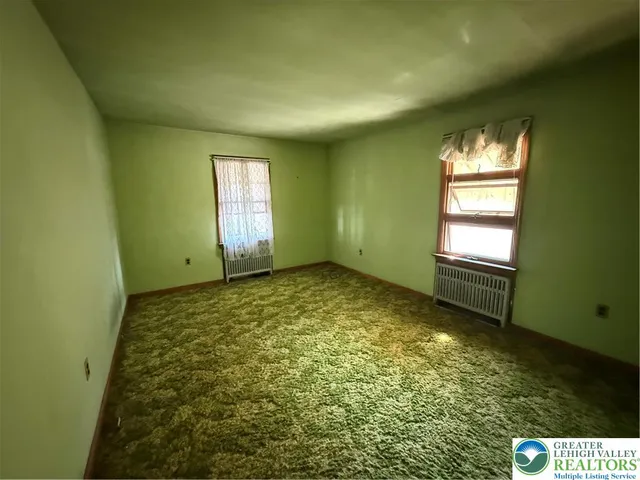 a view of an empty room and window