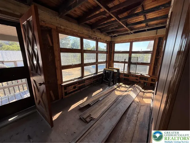 a view of two chairs in the balcony