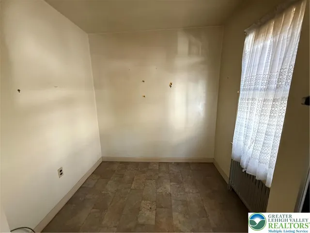 a kitchen with granite countertop a sink stainless steel appliances and cabinets