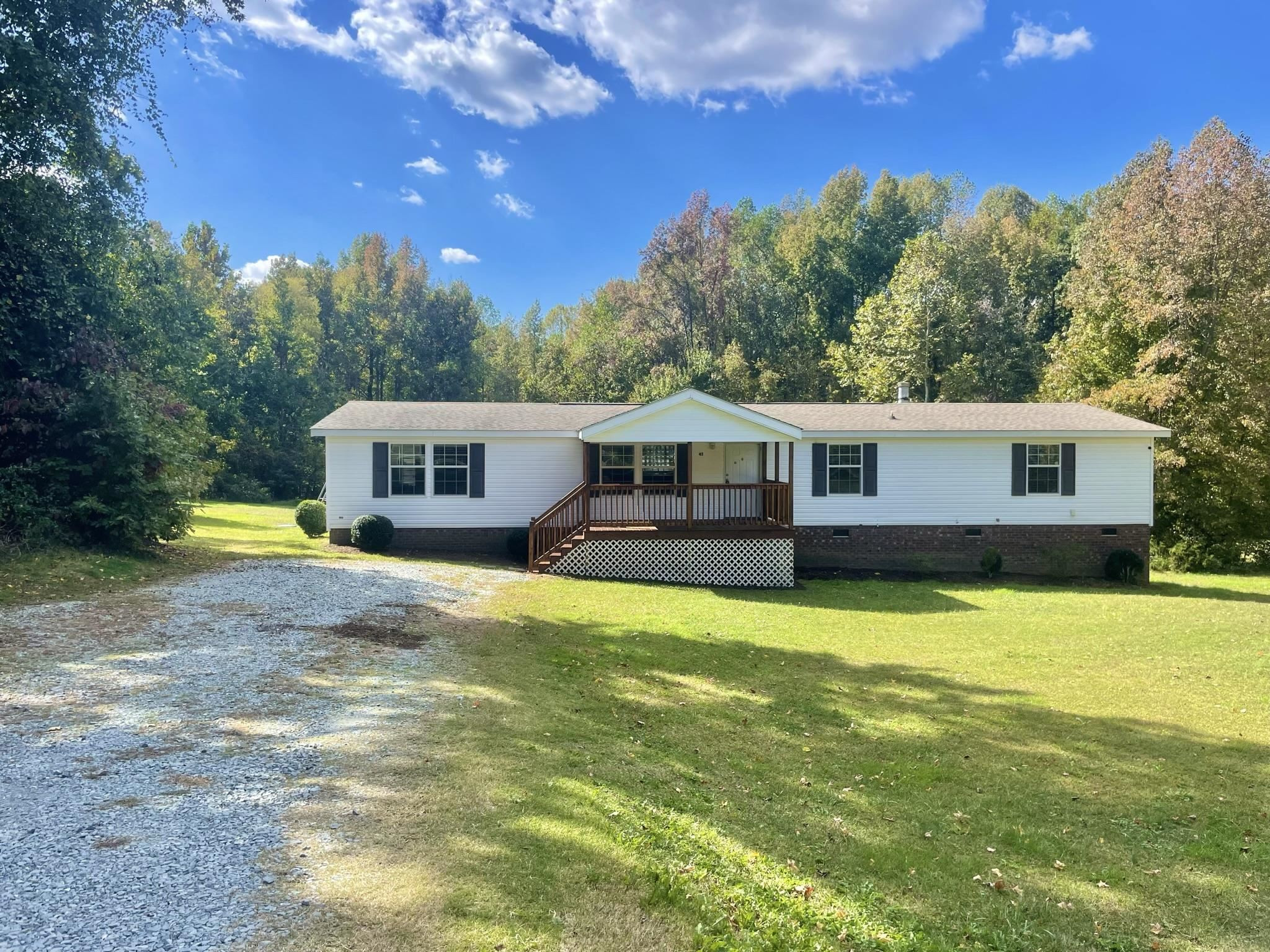 45 Divine Lane Roxboro, NC 27573 - Photo 2 of 28 a front view of a house with swimming pool having outdoor seating