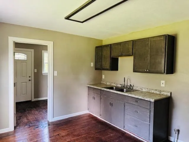 a bathroom with a double vanity sink and mirror