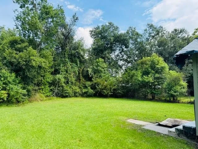 a view of a garden and basketball court